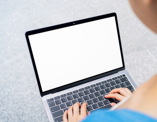 Fototapete - Woman hand type on the keyboard on laptop with mockup of blank screen for the application.