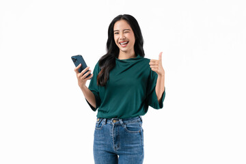 Wall Mural - Cheerful beautiful Asian woman holding smartphone with shows like sign on white background.