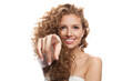 © artmim - Isolated woman pointing finger at camera on white background with copy space
