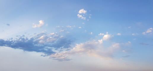 Wall Mural - soft blue sky has the light of the sun and small clouds, weather background