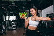 © Quality Stock Arts - Healthy women in Fitness Gym Body Care by Eating Vegetable and weight Training in Sport Club.