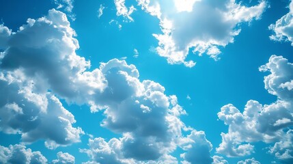Wall Mural - The sky is blue with a few clouds scattered throughout