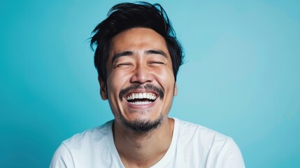 Wall Mural - A man is smiling in front of a blue background
