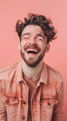 Wall Mural - A man with curly hair is laughing