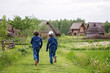 © Tomsickova - Happy Children, boys, running and jumpring on path in park with trees