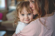 © PixelGallery - Heartwarming photo of a mother and daughter sharing an affectionate hug