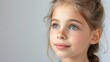 © Руслан Галиуллин - portrait caucasian little blonde girl with earrings on grey background