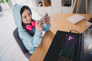 Poster - Photo of nice cute adorable girl user holding gadgets playing modern technology indoors house