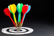 © patpitchaya - All the colorful darts hit on the center of the target, all for one purpose, set only one goal, business and marketing competition concept