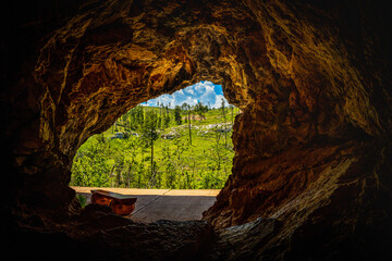 Jewel Cave National Monument Historic Site with outside hill view: The Beautiful Rock Formation and Opening at Custer State Park, Black Hills Country, South Dakota