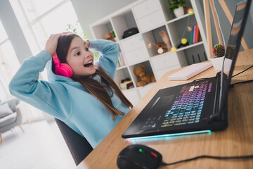 Sticker - Photo of cheerful charming glad girl little gamer playing online video game modern technology indoors house