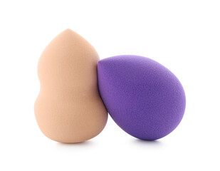 Poster - Beige and violet makeup sponges isolated on white