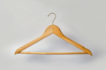 Poster - A simple wooden hanger leaning against a white wall, perfect for decorating or adding a touch of rustic charm to any room