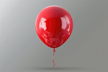 Poster - A single red balloon floats in the air on a gray background