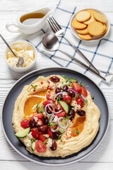 Wall Mural - Greek hummus with veggies, olives, feta on plate