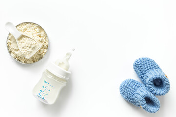 Wall Mural - Bottle of milk for baby feeding with powdered milk in spoon