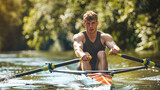 A single rower propels their boat through a calm river, surrounded by lush greenery and bathed in sunlight. The rowers focused expression reveals their dedication to the sport