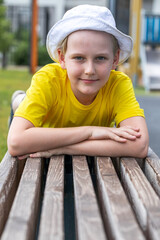 Wall Mural - Portrait of a little boy wearing a yellow t-shirt