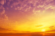 © vvvita - Blazing cloudy sky at sunset. Gradient color. Sky texture. Abstract nature background