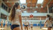 © Pinklife - A girl wearing a sports uniform and playing volleyball with teammates in an indoor sports facility with natural light streaming through the roof windows.