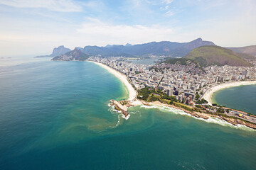Wall Mural - Aerial view, ocean and buildings in city, mountain and architecture in Brazil, tourism and destination. Morning, above and travel in Rio De Janeiro, water and outdoor for vacation and explore