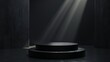 © mikeosphoto - Tiered black pedestal podium in a dark setting with dramatic lighting. Ideal for product displays, exhibitions, and presentations, showcasing elegance and sophistication