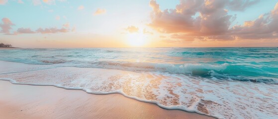 Wall Mural - Sunset over a tranquil beach with gentle waves