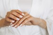 © anatoliycherkas - Close-up bride hands touching wedding ring at home