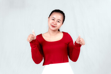 Wall Mural - A young Asian woman with a happy successful expression