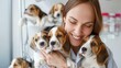 © Pinklife - A joyful woman hugs three cute puppies with a bright smile, capturing a delightful moment full of affection, warmth, and contentment, surrounded by the playful young dogs.
