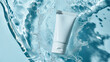 © Curioso.Photography - A white cosmetic tube floating in water with ripples and splashes.