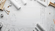 © Sawyer0 - Architect's workspace seen from above. There are architectural designs, construction plans and engineering instruments on the table. Construction background with space for your own text.