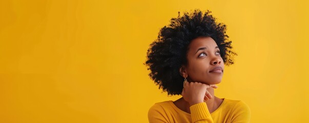Wall Mural - A woman with curly hair is looking at the camera. The background is yellow. The woman's hair is styled in a way that it looks like it has been sprinkled with glitter. Free copy space for text.