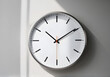 © AshArts - Wall Clock isolated on a gray background