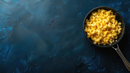 Canvas Print - Pan filled with creamy macaroni and cheese on dark textured surface