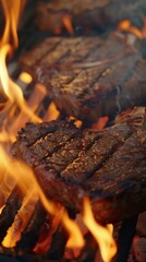 Wall Mural - Juicy steaks grilling over open flames, close-up. Culinary delight and barbecue concept