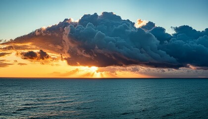 Canvas Print - dramatic stormy sunset over the sea with a huge cloud above it