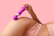 © Pixel-Shot - Beautiful young woman in sexy underwear with vibrator lying on pink background, closeup