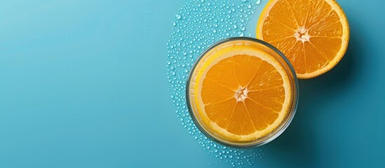 Poster - Orange Slices and Water Droplets on a Turquoise Background