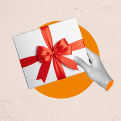 Poster - A human hand holding a gift box with a red ribbon