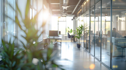 Beautiful blurred minimalist defocused soft background of a light modern office interior with closeup of green potted plant productive workers, large windows, calm, positive emotion