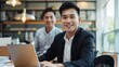 © Khoirul - Businessman or asian office worker employee is discussing with friend in office room. Financial business report presentation.