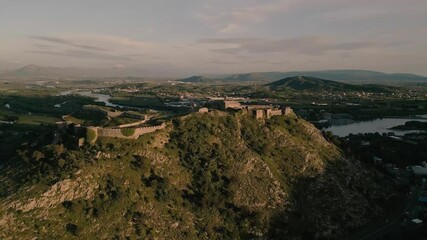 Wall Mural - Aerial view of a hilltop castle at sunset in Albania