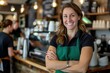 © Iswanto - Smiling Barista with Crossed Arms in a Coffee Shop