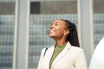 Confident Black Businesswoman Smiling Outdoors in Urban Setting