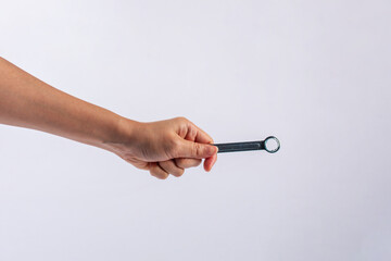 Wall Mural - Hand holding a wrench isolated on white background.