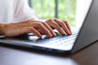 © Farknot Architect - Closeup image of a woman hands working and typing on laptop computer keyboard