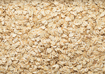 Wall Mural - Organic healthy oatmeal cereal flakes textured background.Macro.