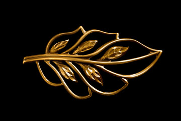 Wall Mural - Golden brooch on black