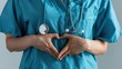 © Studio Nova - The nurse making heart gesture